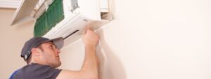 HVAC technician repairing a ductless mini-split