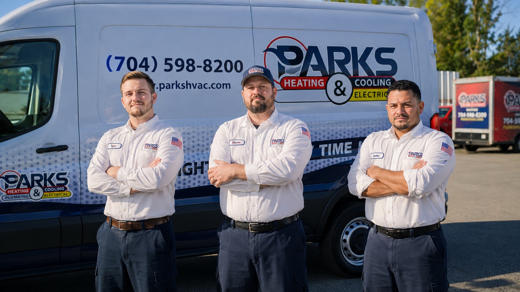 Three Parks technicians standing in front of a branded service van